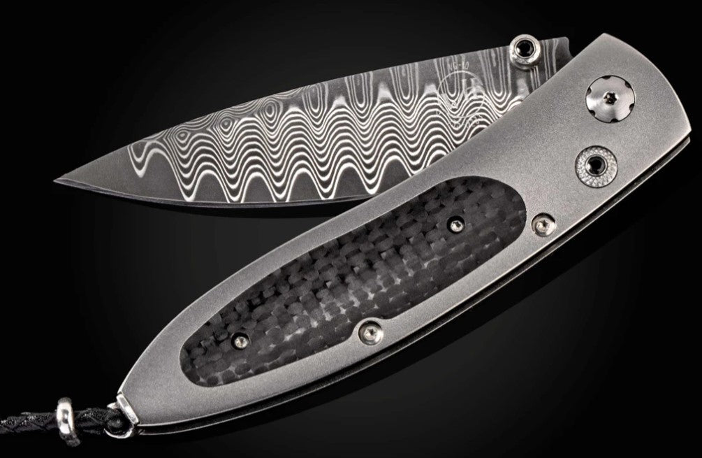 Titanium pocketknife with carbon fiber and 'wave' damascus blade