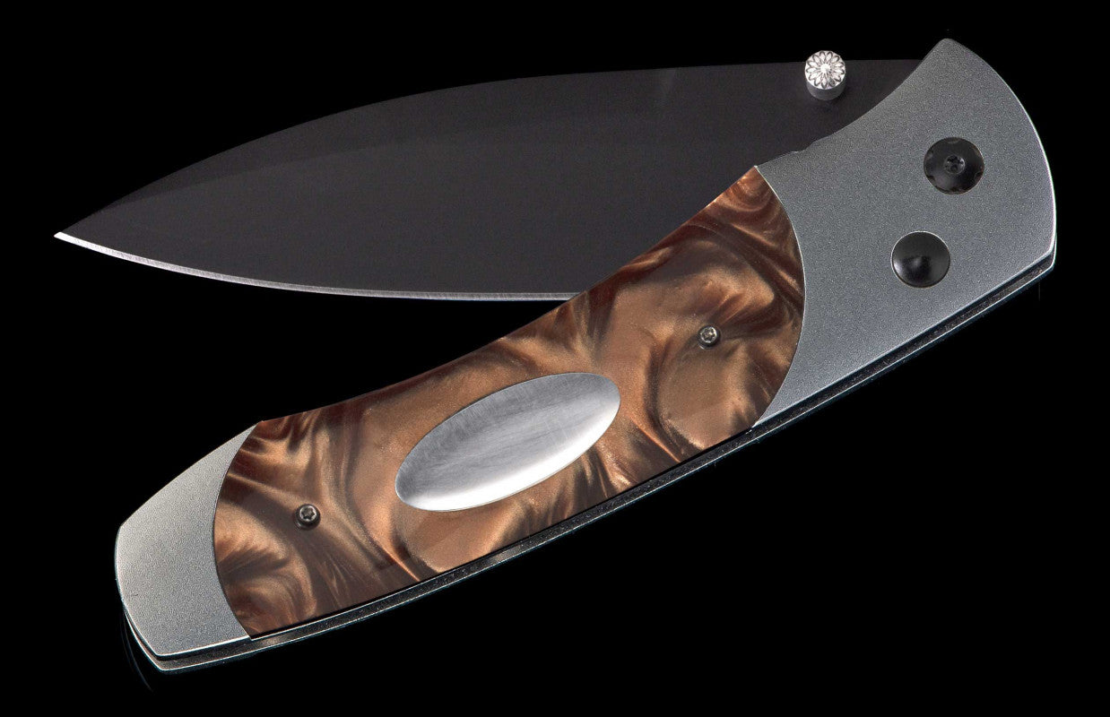 Titanium pocketknife with compressed acrylic resin and stainless blade