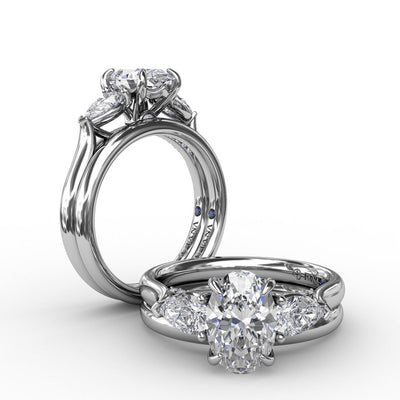 Classic Three-Stone Oval Engagement Ring With Pear-Shape Side Stones