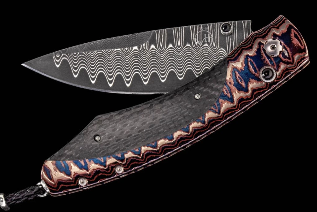 Midnight Sky Folding knife featuring 'wave' mokume, carbon fiber and 'wave' damascus blade