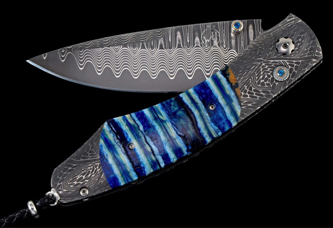 Arctic II Pocketknife featuring hand-forged damascus and fossil mammoth tooth